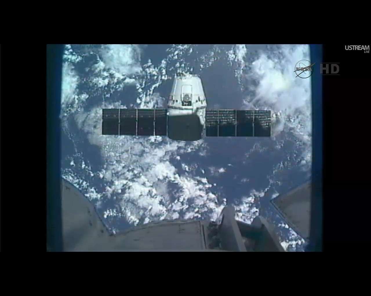 dragon preparing to berth ISS view.jpg